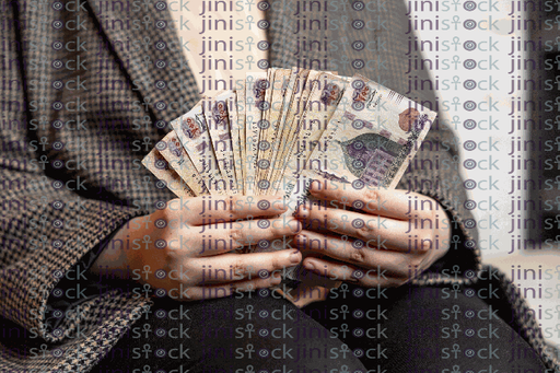 A hand holding many 200 Egp Egyptian money stock image with high quality