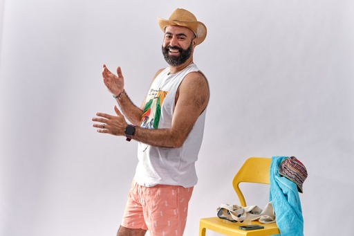 man laughing wearing summer out fit.