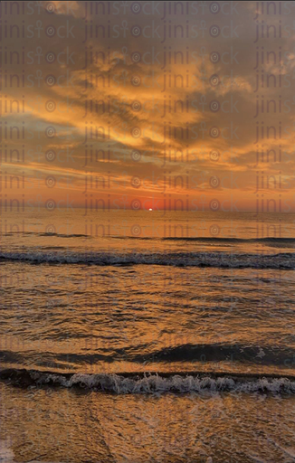 sunset over the sea and a sandy beach