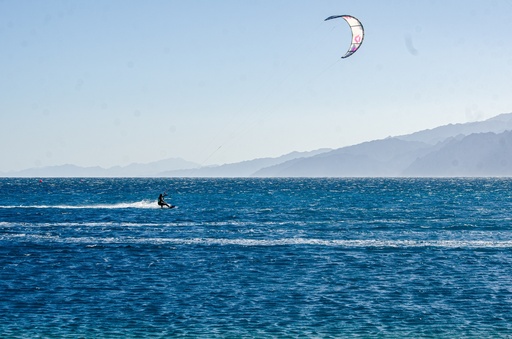 kite surfing over the sea.