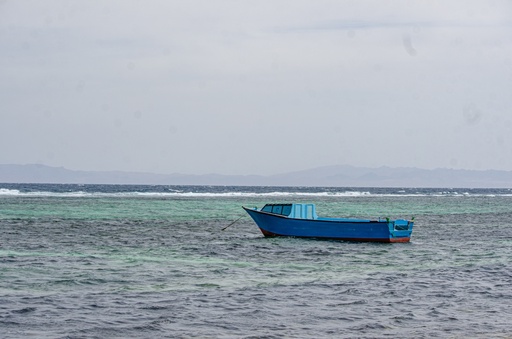 Blue boat in the lagoons.