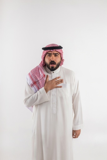 a khaliji man holding his chest stock image