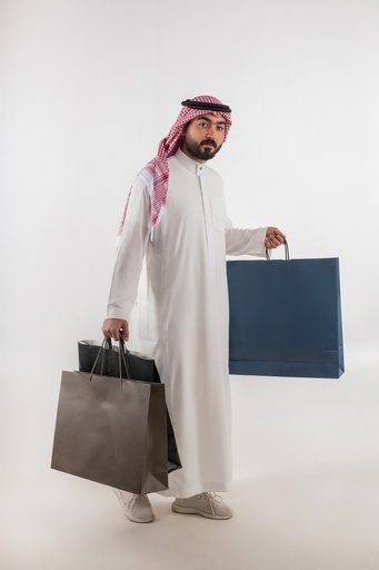 a khaliji man with shopping bags stock image on isolated image