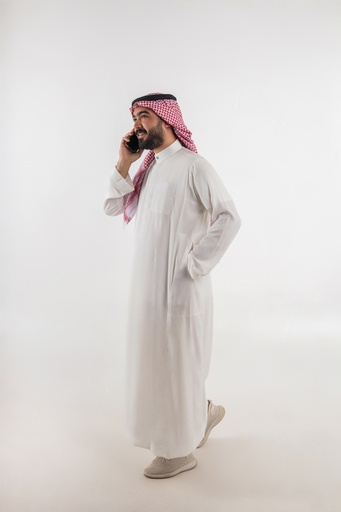 a man from gulf talking on mobile stock image