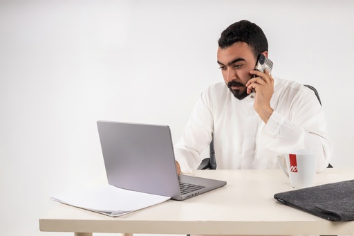 a khaliji man talking on business stock image