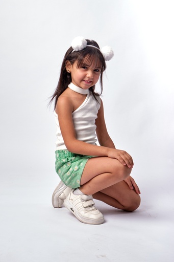 Little girl sitting on one knee and smiling to the camera