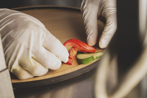 Chef working on a dish garnish