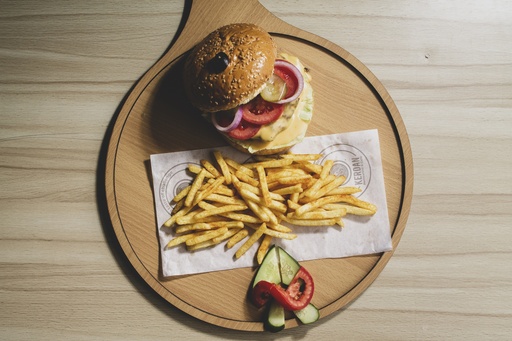 top view for a burger with fries on a restaurant table