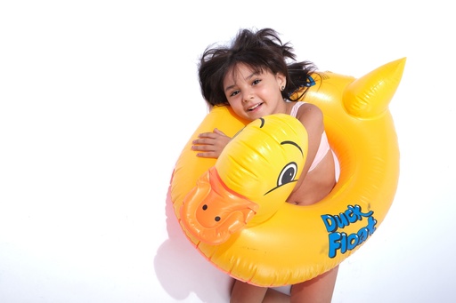 little girl swimming with duck water floater