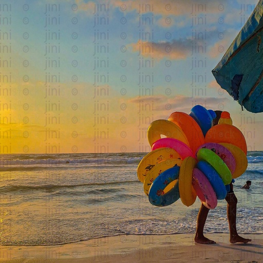 Floats seller in Alexandria beach and holding colourful water floaters