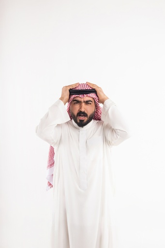 khaliji man with hands on head stock image