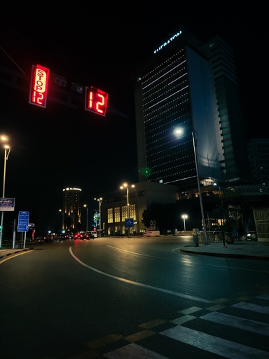 traffic light in Tahrir Street at night  in front of el Sheraton hotel