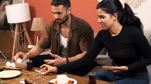 breakfast table while couple eating jam and drinking tea