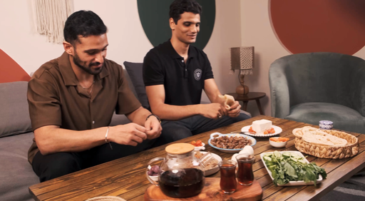 Men eating foul and oriental Egyptian breakfast in the living