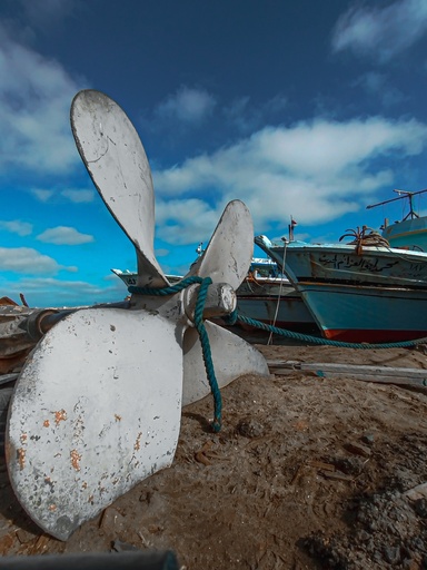 Boat motor fan in the beach sand