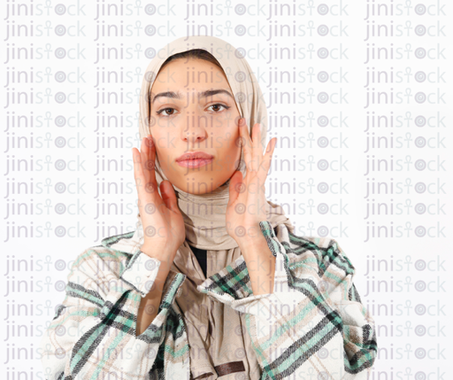 Isolated vieled female woman touching her face high quality stock image
