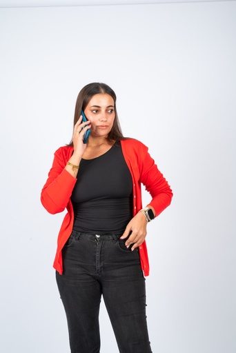 Egyptian woman with blond highlights talking on the phone