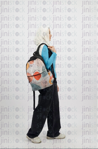 Hijabi girl carrying a backpack - close-up profile - stock image