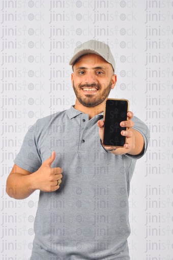 a delivery guy works as a courier holding a mobile with a black screen showing thumb up