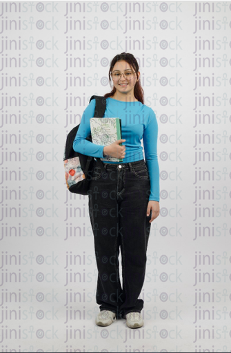 Smiling girl with glasses holding a book and wearing a backpack - close-up - stock image