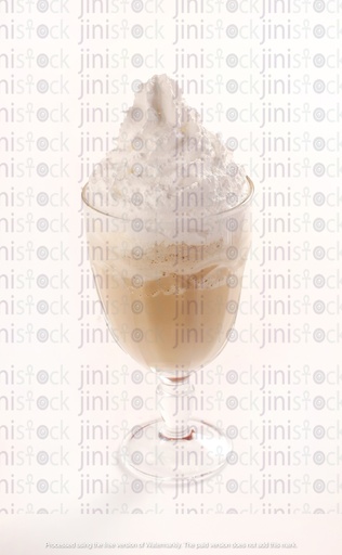 glass filled with creamy vanilla milkshake topped with vanilla sauce whipped cream