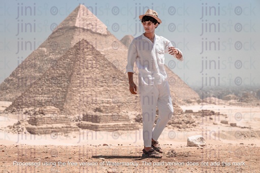 man standing infront of the pyramids