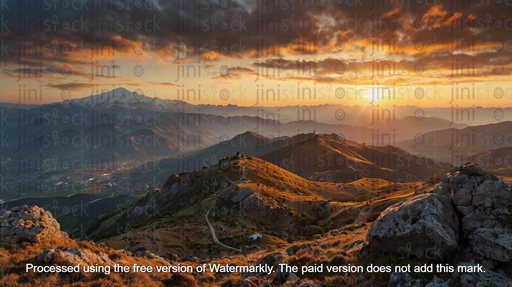 sunrise over high green and rocky mountain