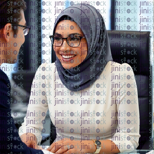 a portrait for arabic woman with beautiful smile while working behind her office  talking to client