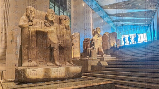 A collection of pharaonic statues in the Grand Egyptian Museum.