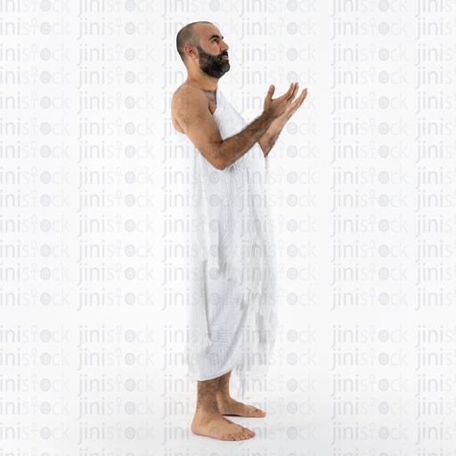 Muslim man in white praying in Umrah