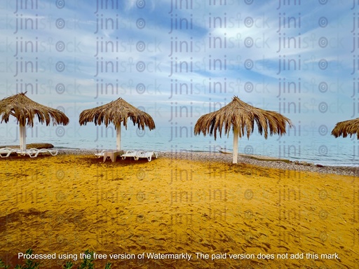 sandy beach and umbrella-made with hay