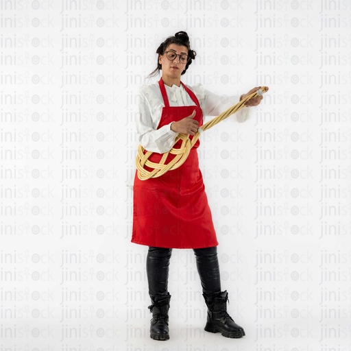 Egyptian housewife in a red apron and using a cleaning stick as a guitar