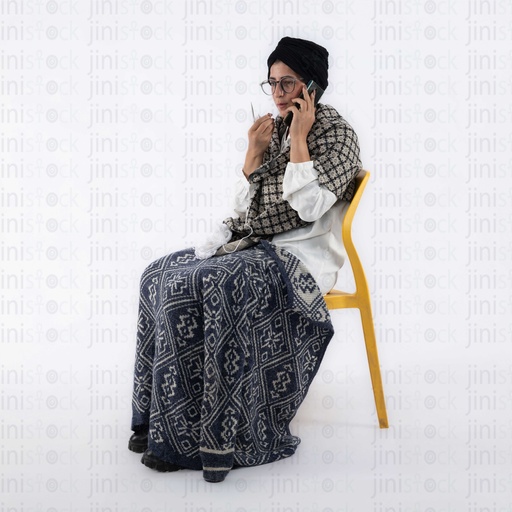 old egyptian grand mother talking on the phone