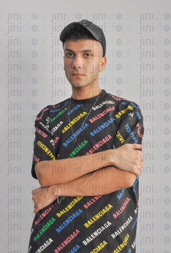 A cool Egyptian man wearing a cap and at-shirt. Summervibes.