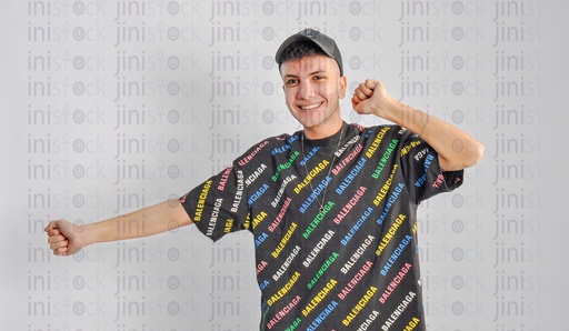 a cool young man wearing cap and dancing