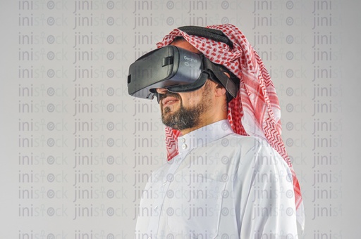 Khaliji man Saudi Arabian or Emirati or A man from the Gulf wearing VR glasses.