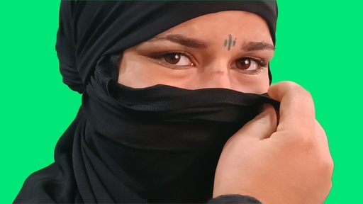 A close up on a girl from upper egypt face while she covers her face