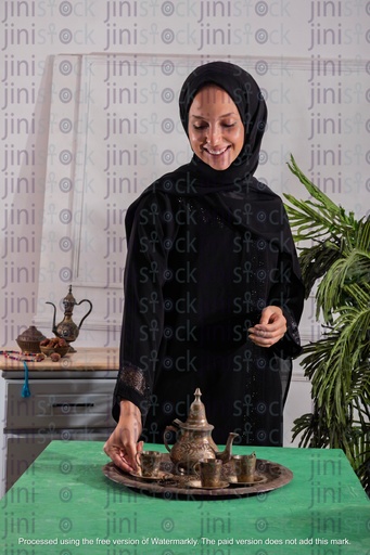 khaliji girl pouring arabic coffee