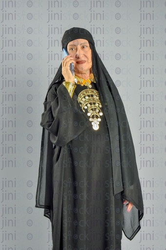 An Egyptian upper Egypt woman talking on the mobile phone