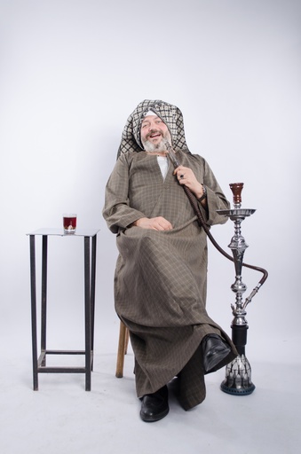 man in galabia sitting on egyptian coffee shop