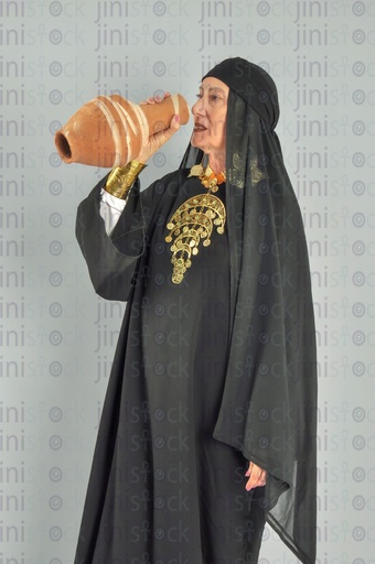 upper Egypt woman drinking from ola