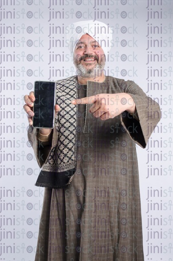 Egyptian man from upper egypt pointing at a mobile