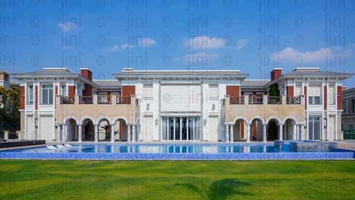 white mansion with a pool