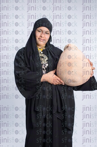 Egyptian girl from upper egypt carrying ballas