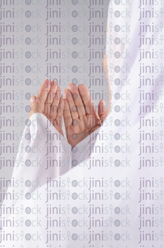 Over the shoulder view for woman praying 