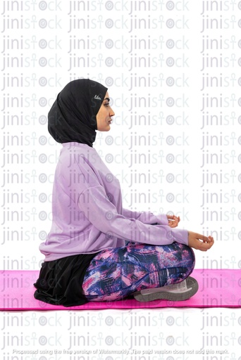 Egyptian woman wearing hijab and doing yoga side view