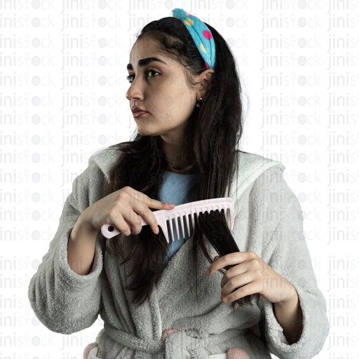 Young Egyptian woman brushing her long black hair