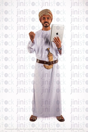 Omani khaliji arab man from gulf holding ipad and happy winning