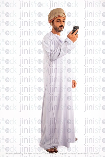 Omani arab khaliji man from gulf checking his phone