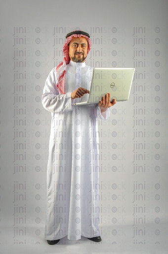 Khaliji, Saudi, Emirati, a man from the Gulf holding a laptop and working on it